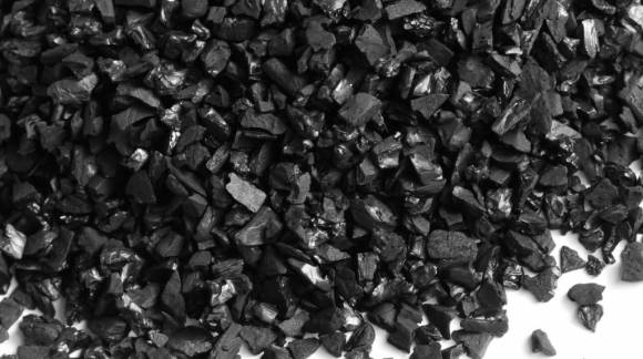 Distillate purification with charcoal.